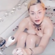 Illustration for article titled Madonna deletes post calling coronavirus a great equalizer from bathtub filled with rose petals